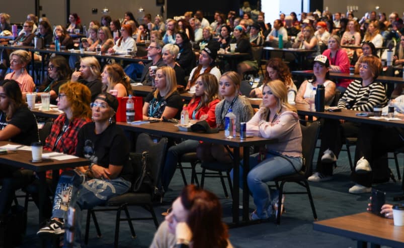 Hairstylists packed at tables during the Tuesday Business Workshop at The BTC Show